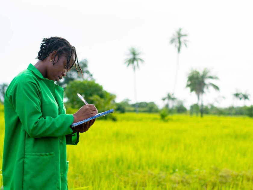 african-farmer-taking-notes-farm