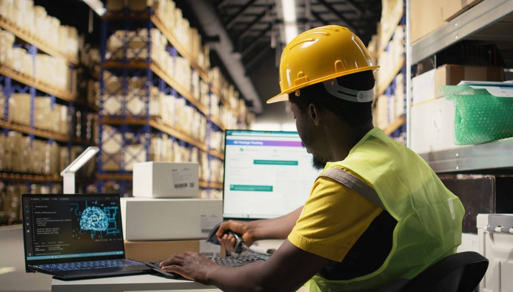 black-employee-works-with-ai-tools-enhance-package-tracking-efficiency